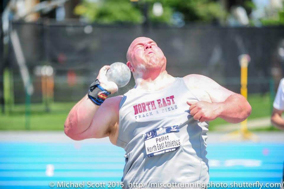 Mike Pellet competing in the shot put